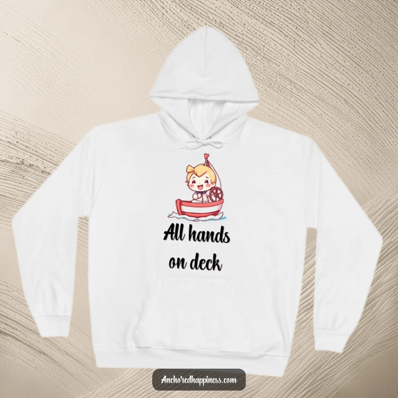 Funny hoodie showcasing a tiny character with a beaming grin, expertly steering a miniature sailboat on a delightful voyage.