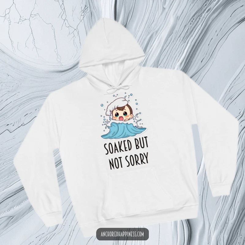 Funny hoodie illustrating a character looking utterly shocked as a playful sea wave splashes them, perfect for beach lovers.